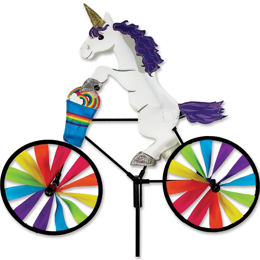 20 in. Bike Spinner - Unicorn featuring colorful unicorn design, spinning gently in the garden under sunny skies.