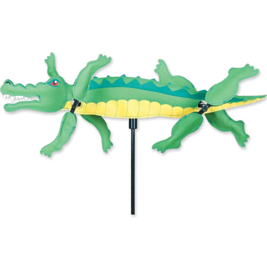 21 in. WhirliGig Spinner featuring an alligator design made from colorful SunTex fabric, spinning in the breeze in a garden setting.