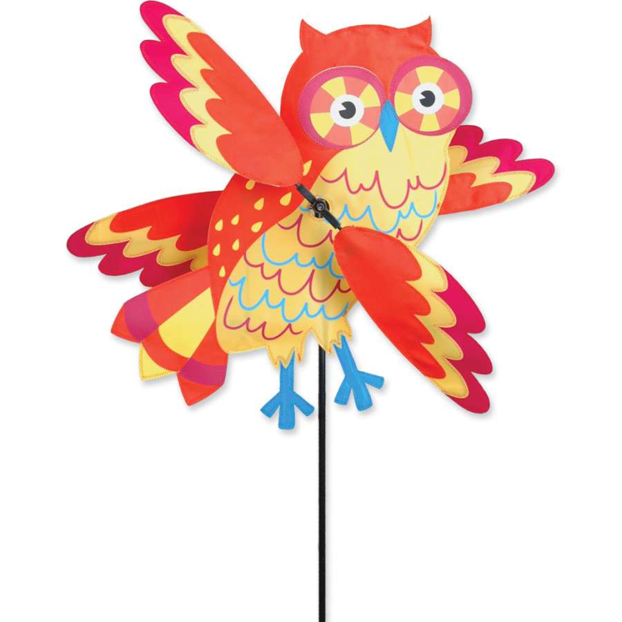 21 in. WhirliGig Spinner - Orange Owl spinning in the wind, showcasing bright orange and whimsical design in a garden setting.