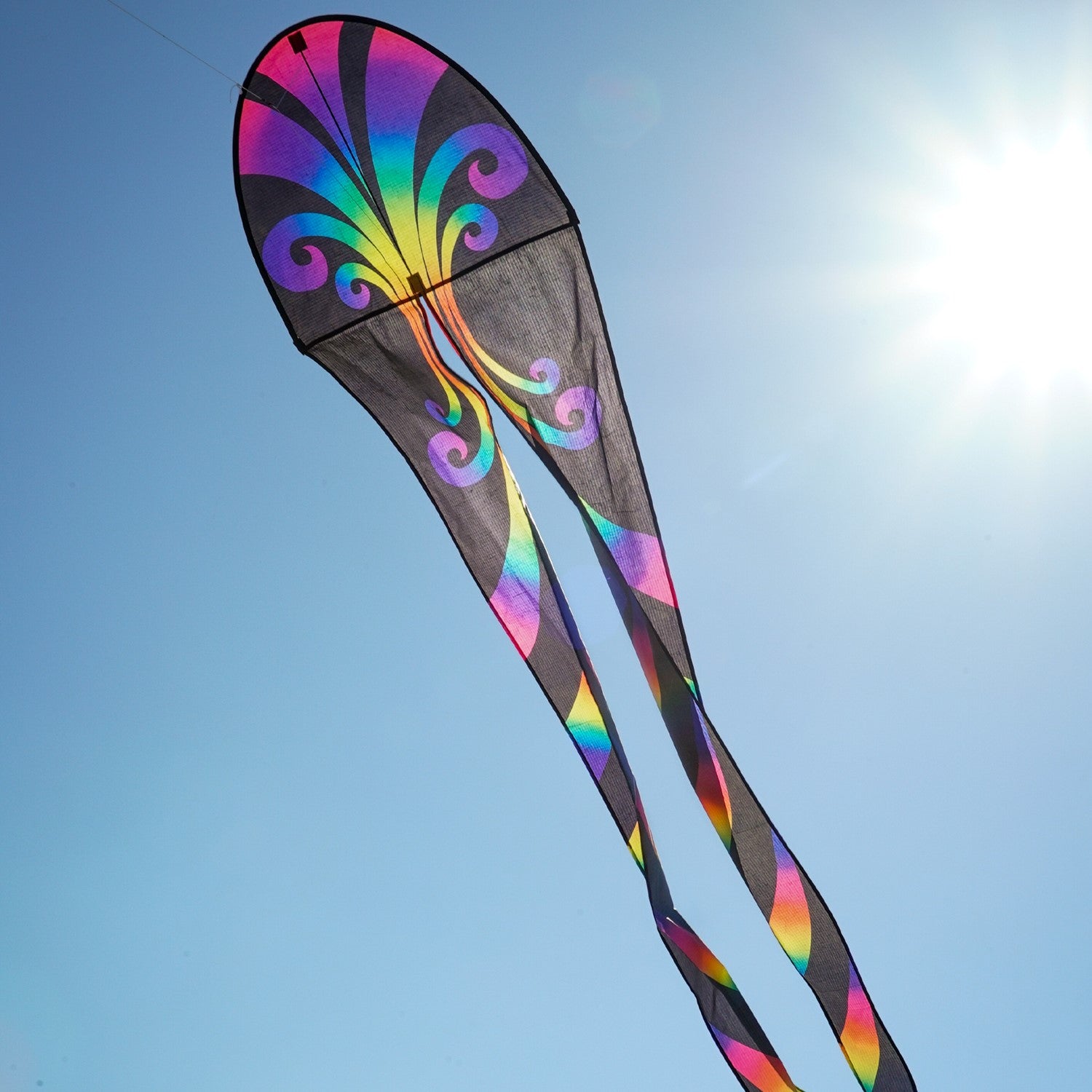 22" Aurora Dancing Dragon Kite with vibrant colors and flowing tails, soaring gracefully against a blue sky, ready for outdoor adventures.