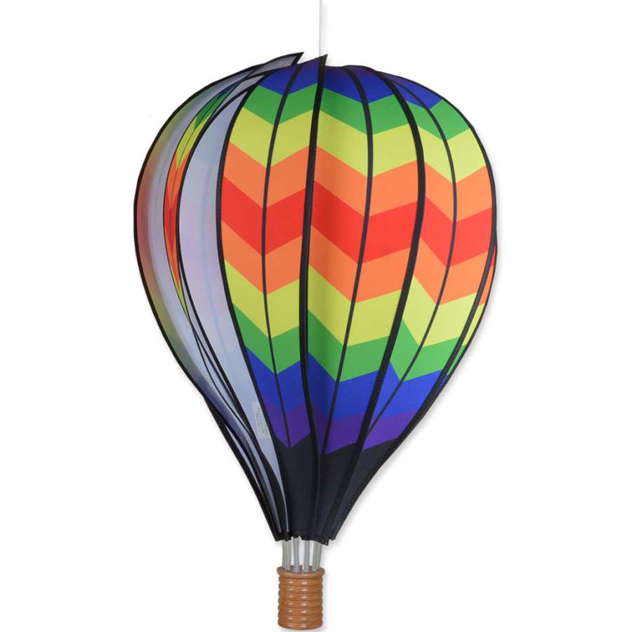 Vibrant 22 in. Hot Air Balloon featuring a double chevron rainbow pattern spinning in the breeze, enhancing an outdoor garden setting.