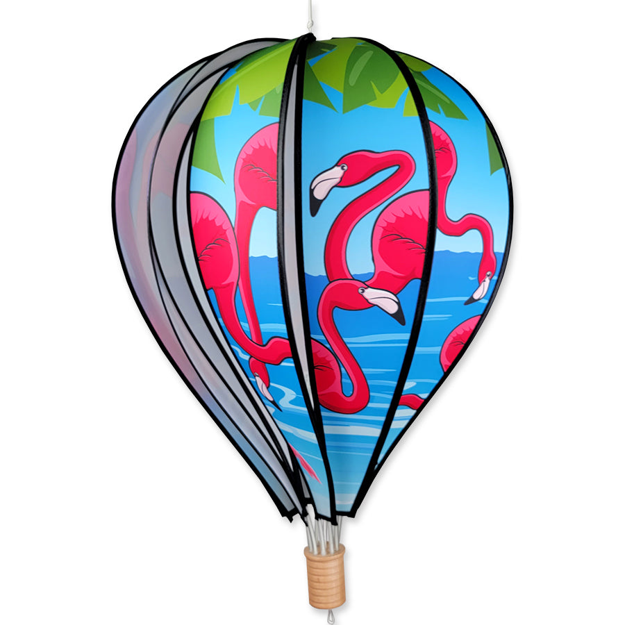 22 in. Hot Air Balloon featuring bright flamingo design spinning in a garden setting, enhancing the outdoor decor.