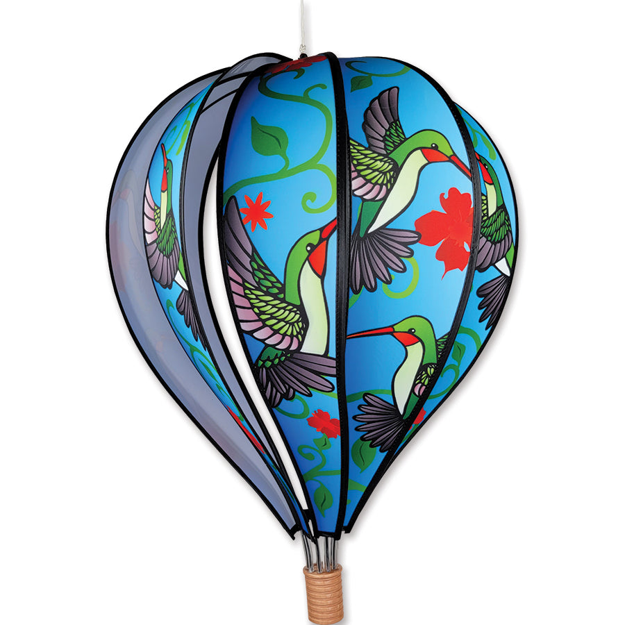 22 in. Hot Air Balloon with a delicate hummingbird design, spinning gracefully in a garden setting, adding a whimsical touch to outdoor decor.