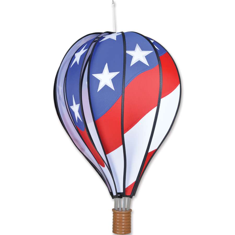 22 in. patriotic hot air balloon spinning in a garden, featuring vibrant red, white, and blue colors for outdoor decoration.