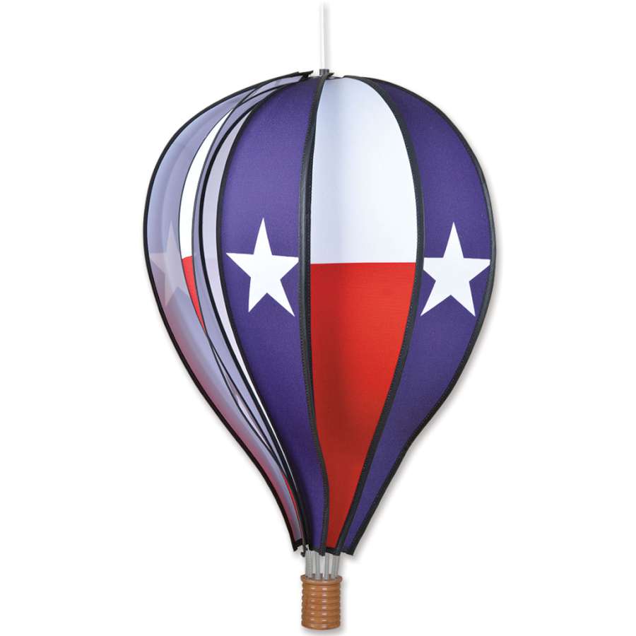 22 in. Hot Air Balloon with Texas flag design, spinning gently on display in a vibrant outdoor garden setting.