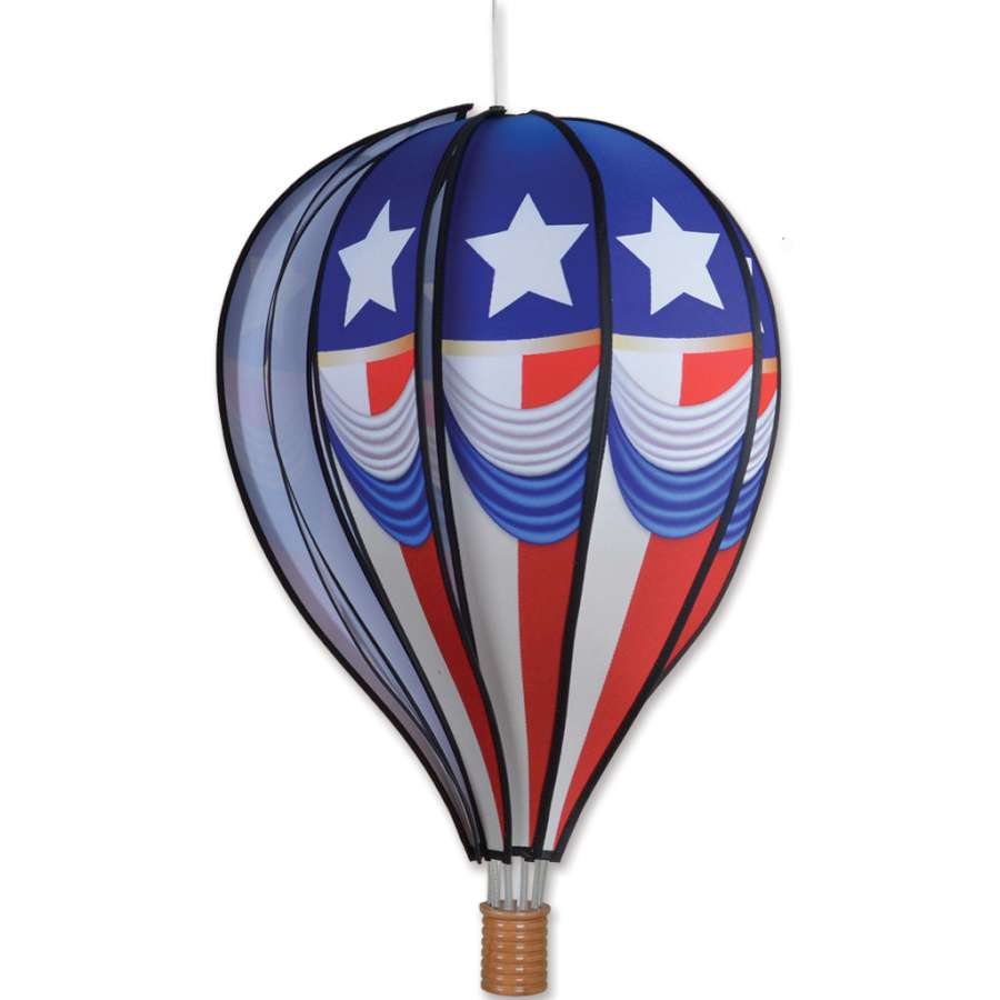 22 in. Vintage Patriotic Hot Air Balloon, spinning gently in the wind, showcasing red, white, and blue colors in an outdoor setting.