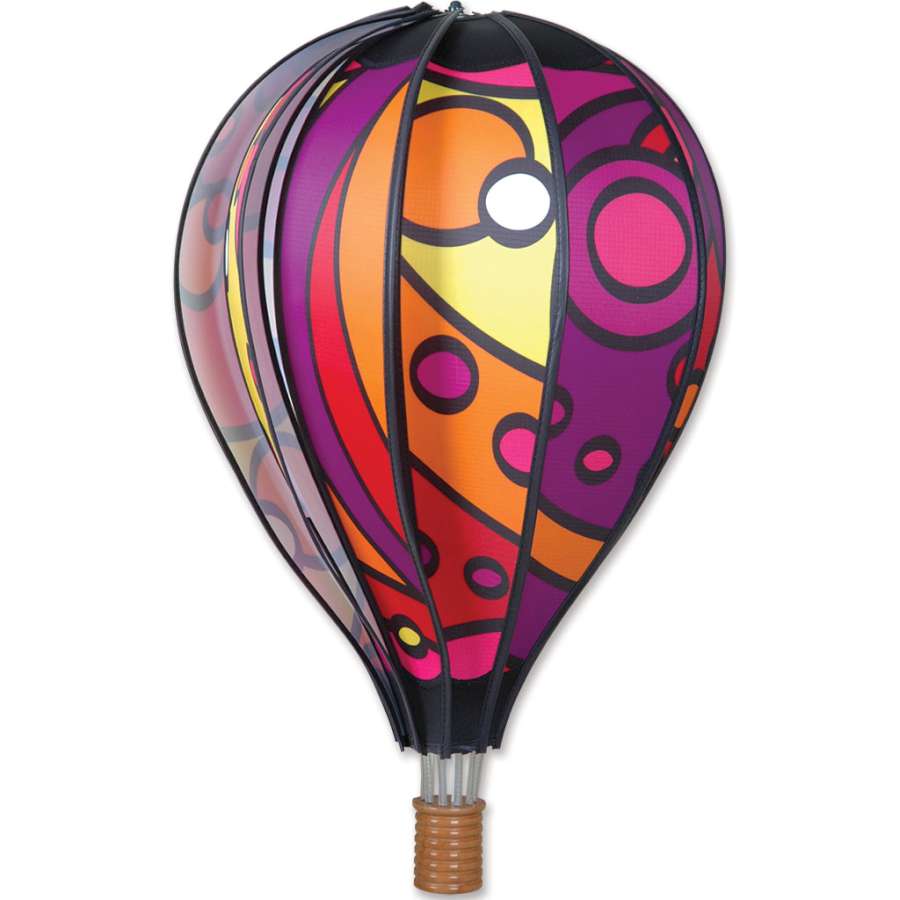 22 in. Hot Air Balloon - Warm Orbit, a colorful spinning decoration displayed in a garden, perfect for creating a whimsical atmosphere.