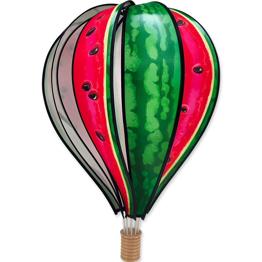 22 in. Hot Air Balloon - Watermelon displayed in a garden setting, spinning gracefully in the breeze, showcasing bright watermelon colors.