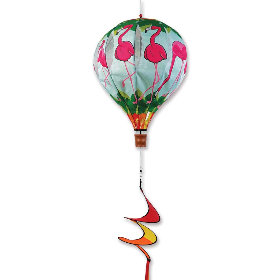 22 in. Pop-Open Hot Air Balloon featuring vibrant hibiscus and flamingo designs, displayed elegantly in a garden setting, spinning in the wind.