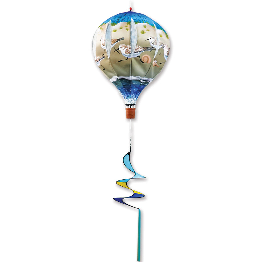 22 in. Pop-Open Hot Air Balloon - Sandpiper spinning gracefully on a deck, showcasing a colorful design that enhances outdoor decor.