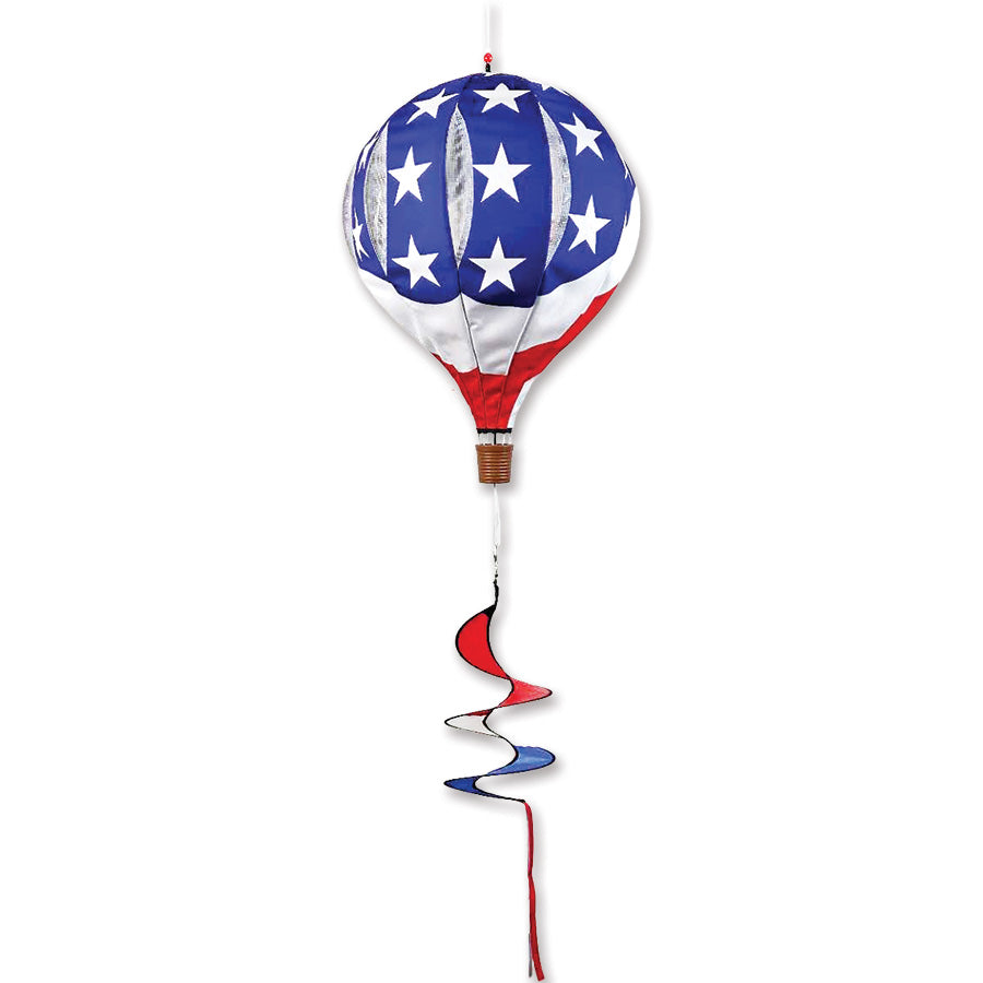 22 in. Pop-Open Hot Air Balloon in Wavy Patriotic design displayed outdoors, gently spinning in the wind with colorful fabric.