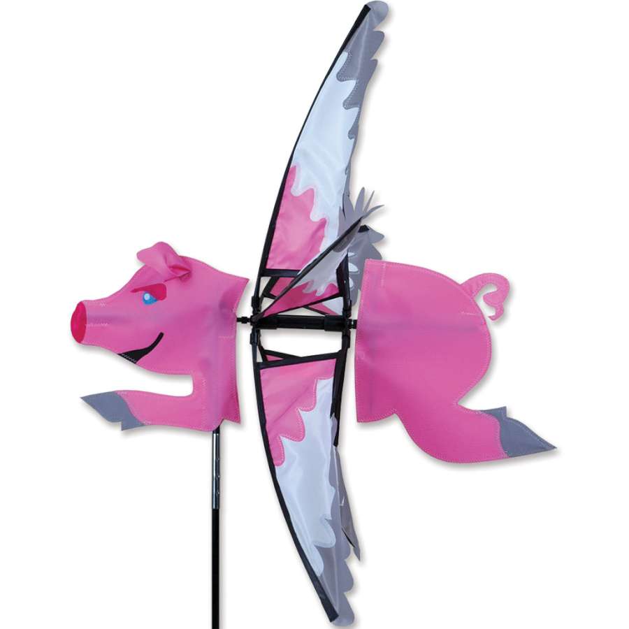 The 23 in. Flying Pig Spinner depicted in a vibrant garden setting, showcasing its playful design and 23-inch diameter.