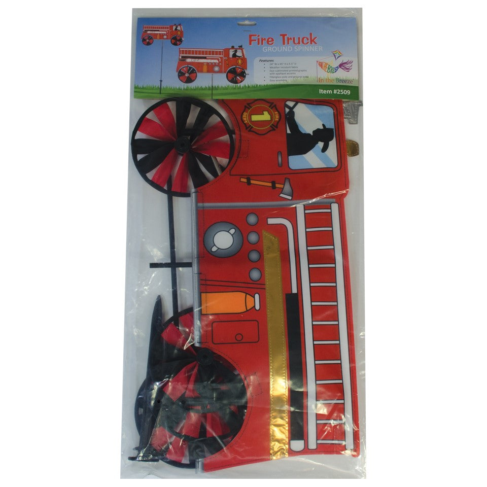Vibrant 24'' Fire Truck Spinner in a garden setting with spinning wheels, showcasing a charming red fire truck design in motion.