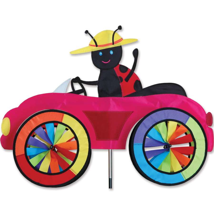 Vibrant 25 in. Car Spinner featuring a ladybug design spins joyfully in an outdoor garden setting, showcasing its bright colors and playful movement.