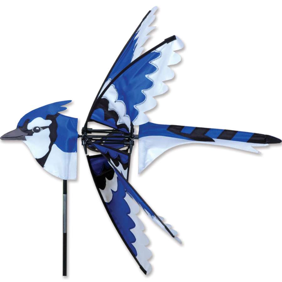 25 in. Eastern Blue Jay Spinner featuring vivid blue jay design, spinning gracefully in an outdoor setting with sunlight shining on it.