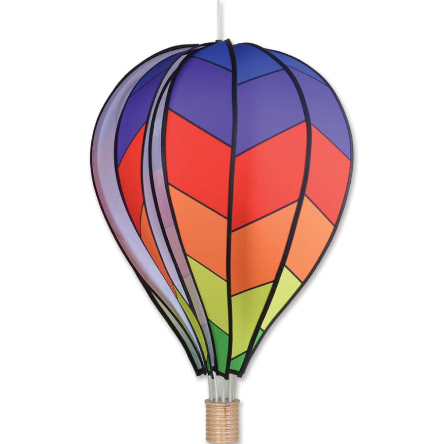 Colorful 26 in. hot air balloon with a chevron rainbow design hanging outdoors, spinning gently in the breeze.