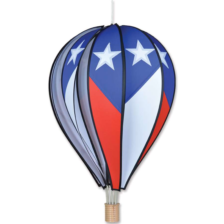 26 in. patriotic hot air balloon decoration displayed outdoors with red, white, and blue colors, spinning gently in the breeze.