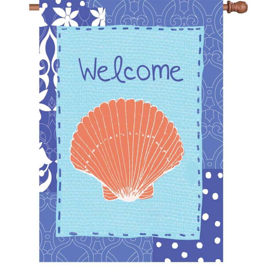 28 in. Coastal Shell house flag showcasing an inviting shell design, fluttering gently in the breeze in a summer outdoor setting.