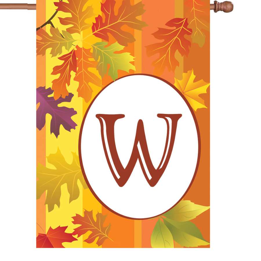 28 in. Fall Monogram Flag - W showcasing a vibrant monogram and autumn leaves, displayed on a decorative flag pole in a charming outdoor setting.