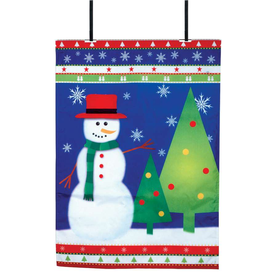 28 in. Fiber Optic Wonderland flag displayed over a front door, illuminating a festive outdoor setting with bright colors and patterns.