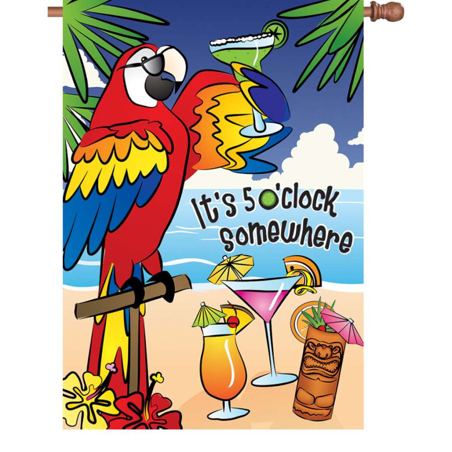 28 in. Flag - 5 O'Clock Somewhere displayed in a garden with bright colors and clear text, emphasizing a carefree lifestyle and leisure.