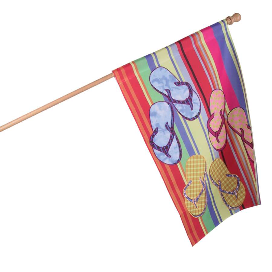 28 in. Flag - Espadrille Flip Flops featuring colorful flag graphics, ideal for summer activities and patriotic events, displayed against a beach backdrop.