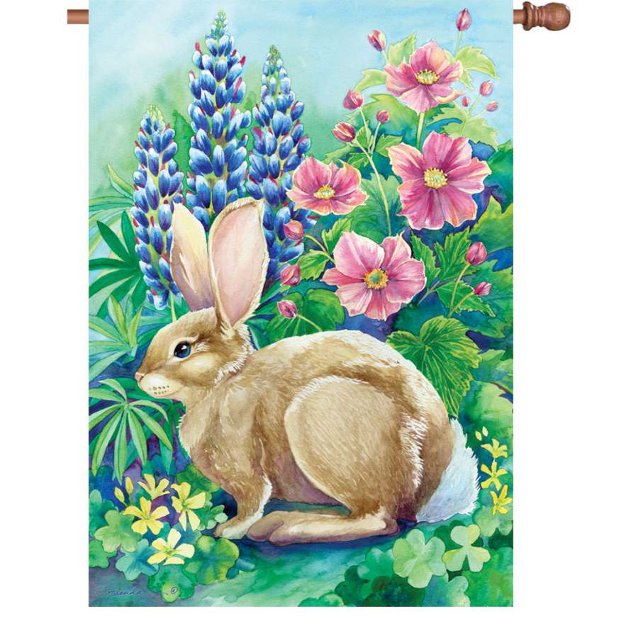 28 in. Flag - Garden Rabbit, illuminated flag showcasing an adorable rabbit design, displayed on an outdoor flagpole in a lush garden setting.