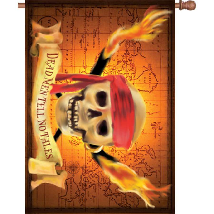 Illuminated 28 in. Tell No Tales house flag displaying a vibrant nautical theme in a garden setting at dusk.