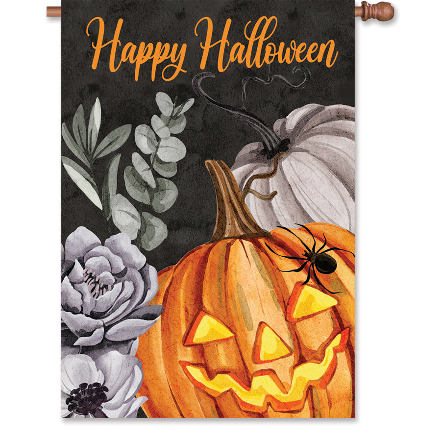28 in. Floral Jack O'Lantern house flag with vibrant colors and a Halloween theme displayed on an outdoor flag stand in a garden setting.