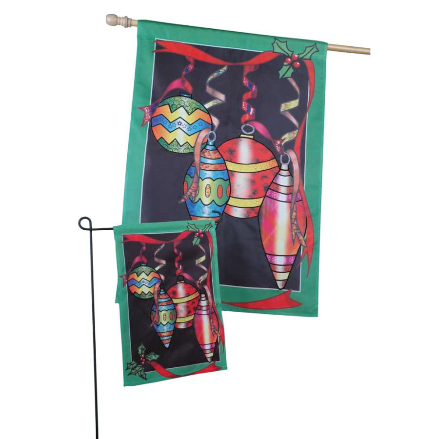 28 in. Glitter Ornaments Flag featuring colorful shimmering ornaments displayed on a flag pole in a winter outdoor setting.