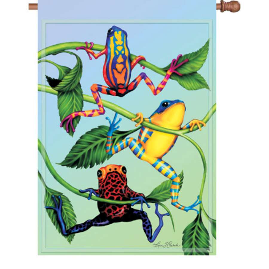 28 in. Hanging Tree Frog flag showcasing vibrant colors and a playful design, displayed on a flagpole in a garden setting.