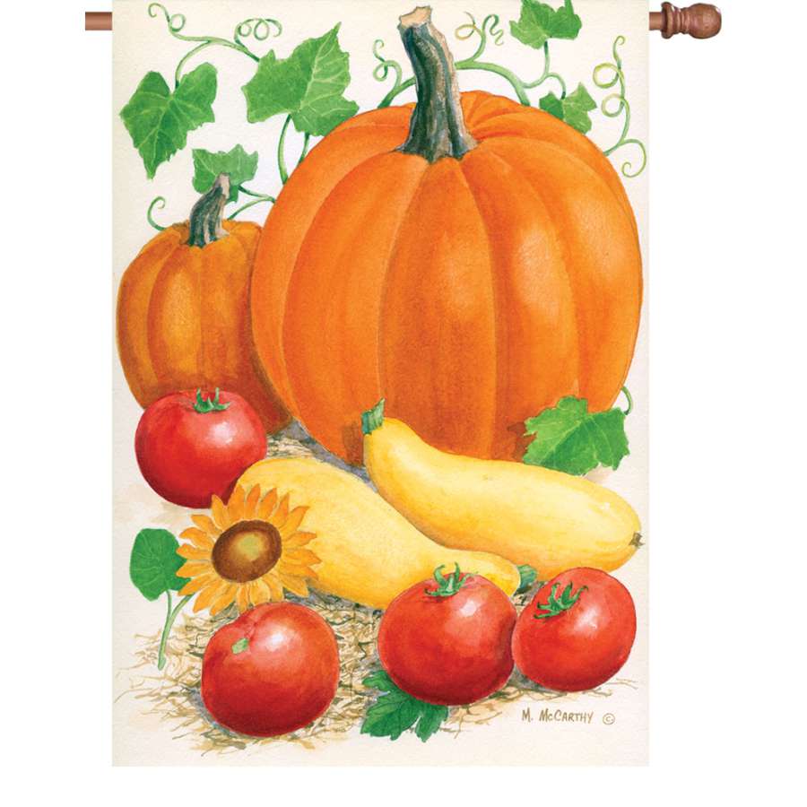 28 in. Harvest Time illuminated flag with vibrant autumn motifs displayed on an outdoor pole in a well-kept garden setting.