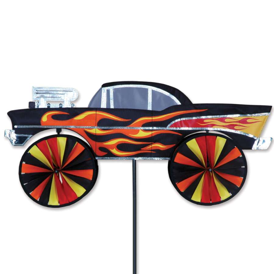 Colorful 28 in. Hot Rod Spinner spinning in the breeze in a vibrant garden setting, showcasing its playful design and outdoor durability.