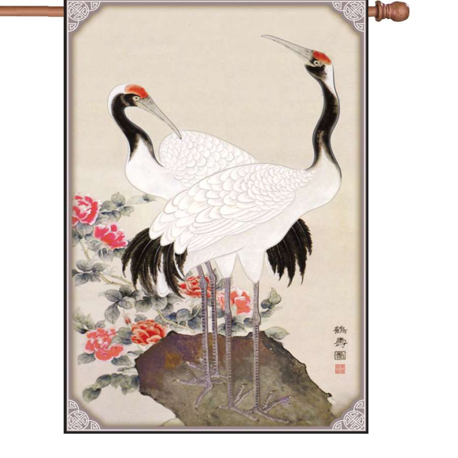 28 in. Longevity Flag displaying colorful nature-themed designs fluttering elegantly in an outdoor garden setting.