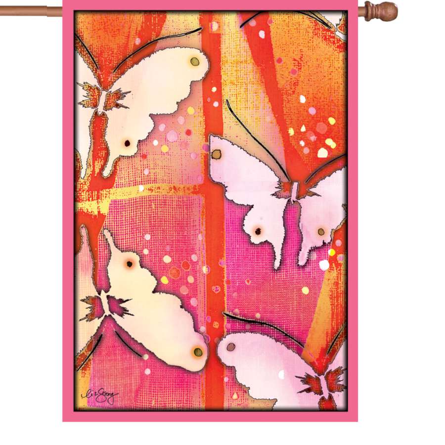 28 in. illuminated Mariposa Flag with vibrant butterfly design displayed outdoors, glowing in the evening light against a backdrop of greenery.