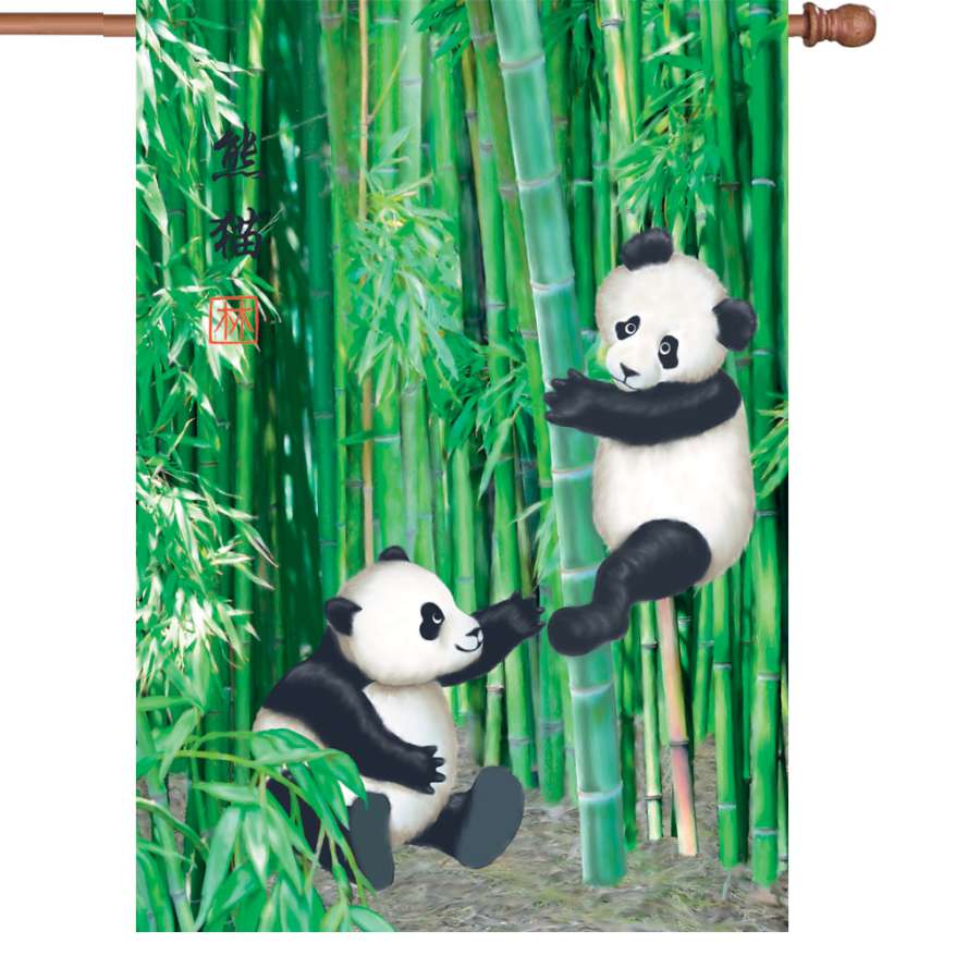28 in. Playful Pandas Flag displayed in a garden setting, featuring vibrant panda designs that illuminate at night, perfect for outdoor decor.