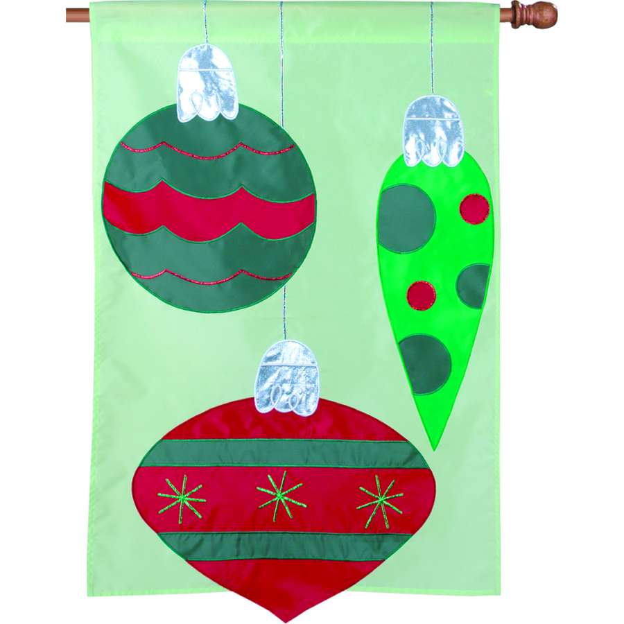 28 in. Sparkly Decor flag featuring a shimmering design displayed outdoors, adding festive charm to a winter holiday setting.