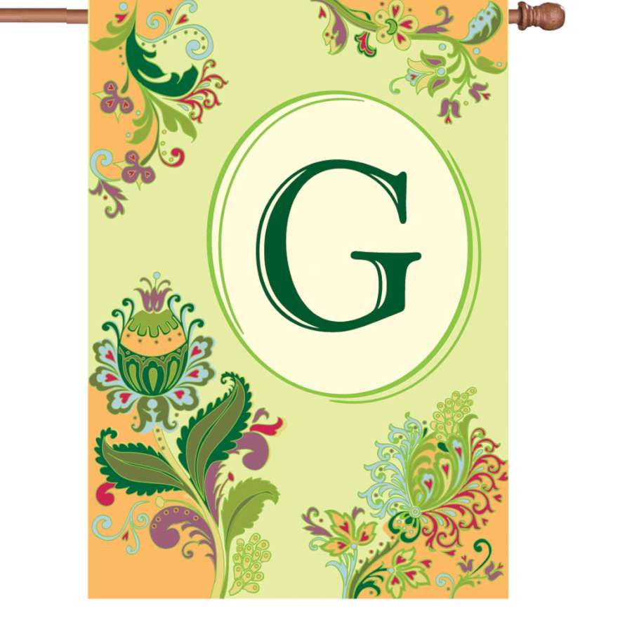 28 in. Spring Monogram Flag - G displayed outdoors, featuring a bright, personalized monogram design suitable for any house.
