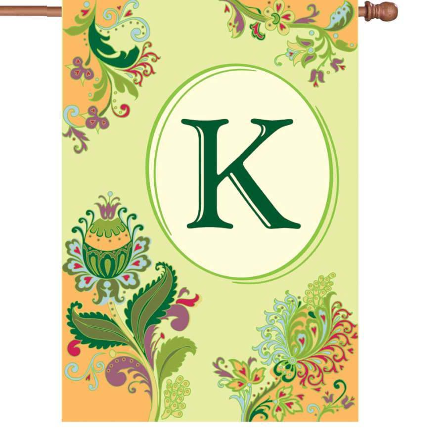 28 in. Spring Monogram Flag displaying the letter K surrounded by floral designs, positioned on an outdoor flagpole.