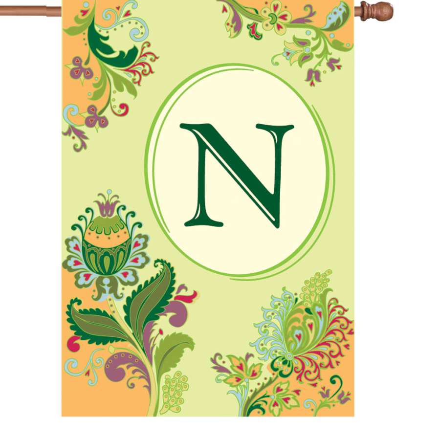 28 in. Spring Monogram Flag - N showcases a vibrant design with an elegant 'N' against a colorful background, displayed outdoors.