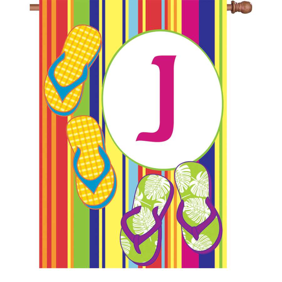 28 in. Summer Monogram Flag - J displayed on a decorative pole, showcasing vibrant colors and intricate detail in a garden setting.