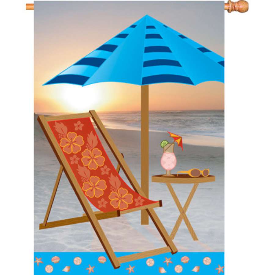 28 in. Sunrise Beach flag with a vibrant sunrise over water displayed on a flagpole in a sunny garden setting.