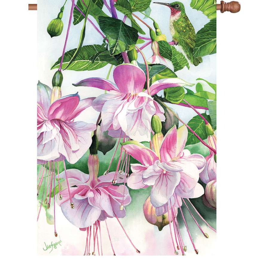 A 28 in. illuminated flag named 'Window on the World,' showcasing vibrant designs and colors, displayed outdoors in a garden setting.