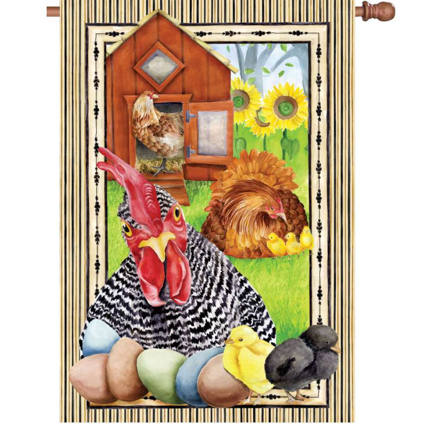 28-inch Not Cooped Up house flag featuring vibrant colors and bird designs, displayed proudly on an outdoor flagpole in a garden setting.