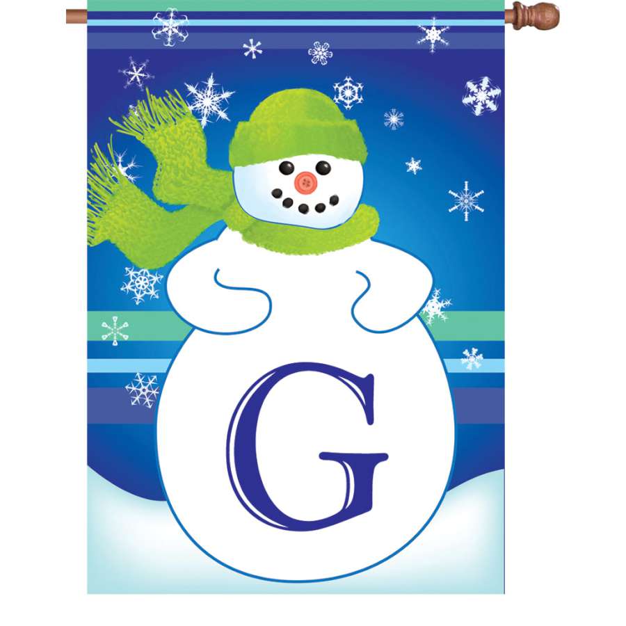 28 in. Winter Monogram Flag - G featuring a bold monogram surrounded by winter decorations, displayed outdoors in a festive setting.