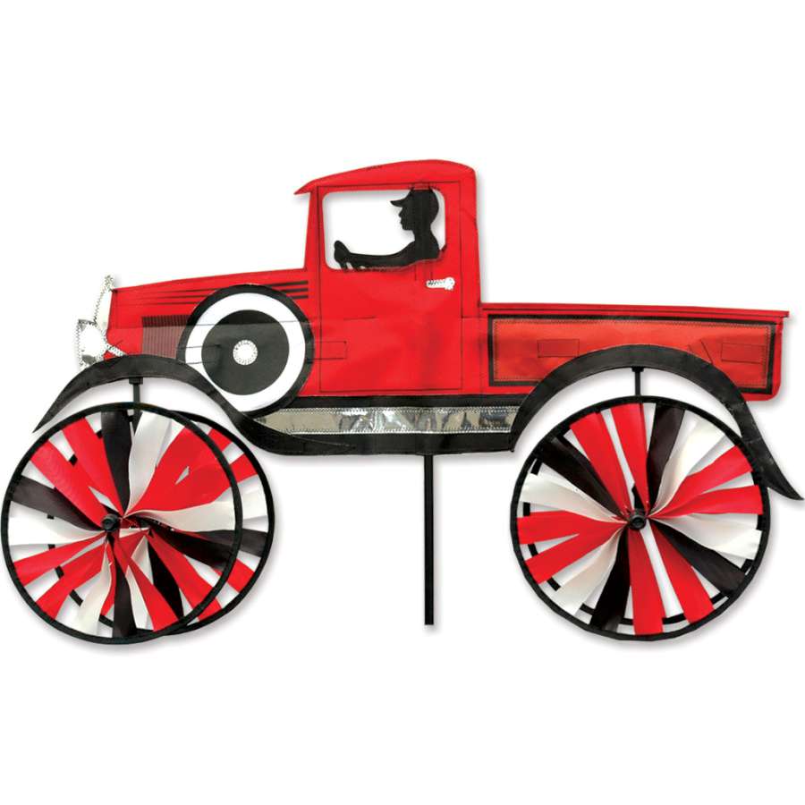 29 in. Old Time Truck Spinner featuring a vintage truck design, spinning in a garden setting surrounded by colorful flowers.
