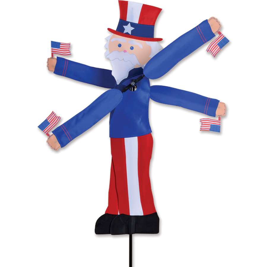 29 in. WhirliGig Spinner featuring Uncle Sam design spinning in a gentle breeze in a garden setting.