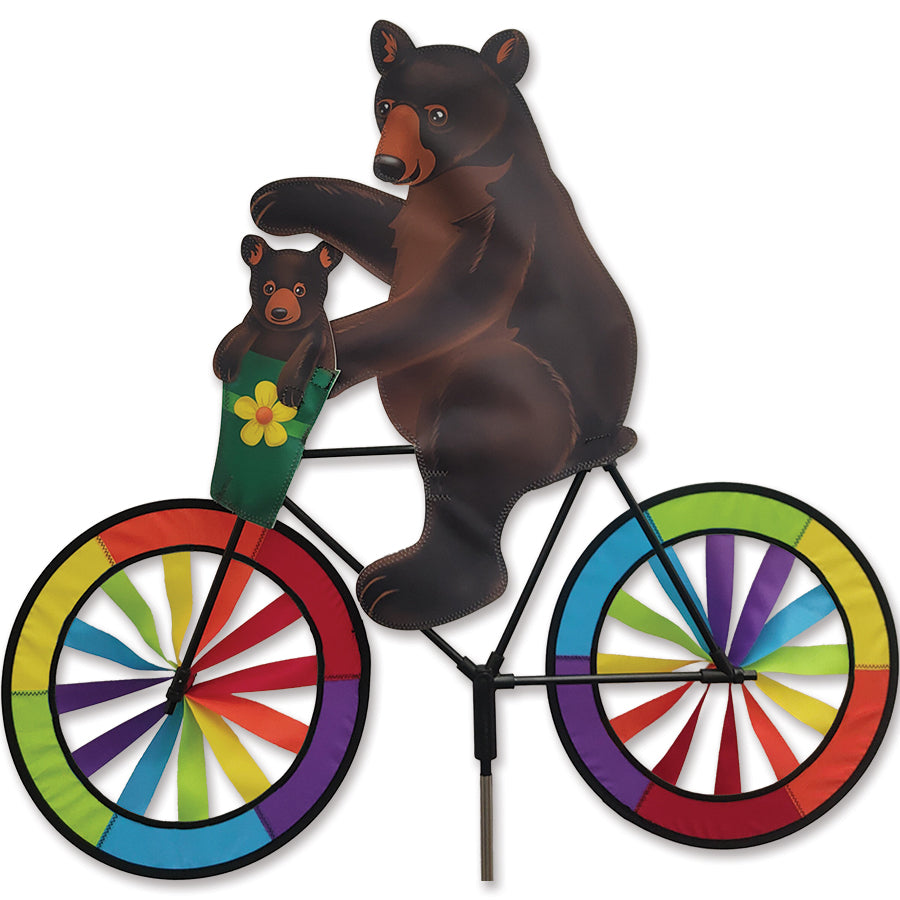 30 in. Bike Spinner - Black Bear displaying vibrant colors and black bear design on a bicycle in a sunny outdoor setting.