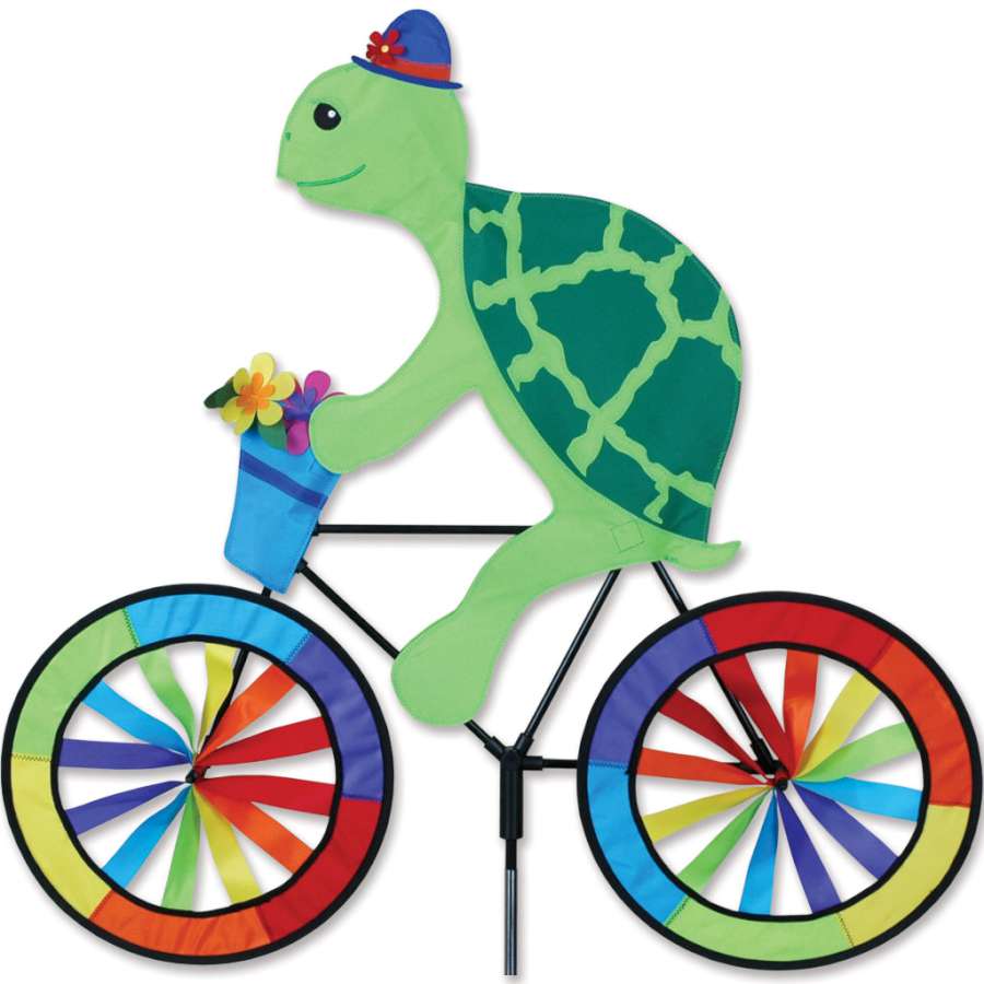 30 in. Bike Spinner featuring a colorful turtle design, displayed spinning on a bicycle in an outdoor setting, showcasing vivid colors in motion.