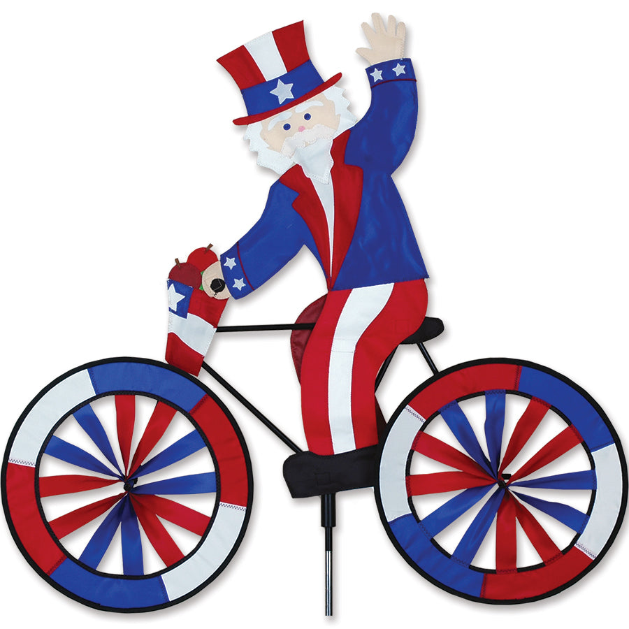 30 in. Bike Spinner featuring Uncle Sam design displayed on a bicycle, showcasing vibrant colors in a sunny outdoor setting.